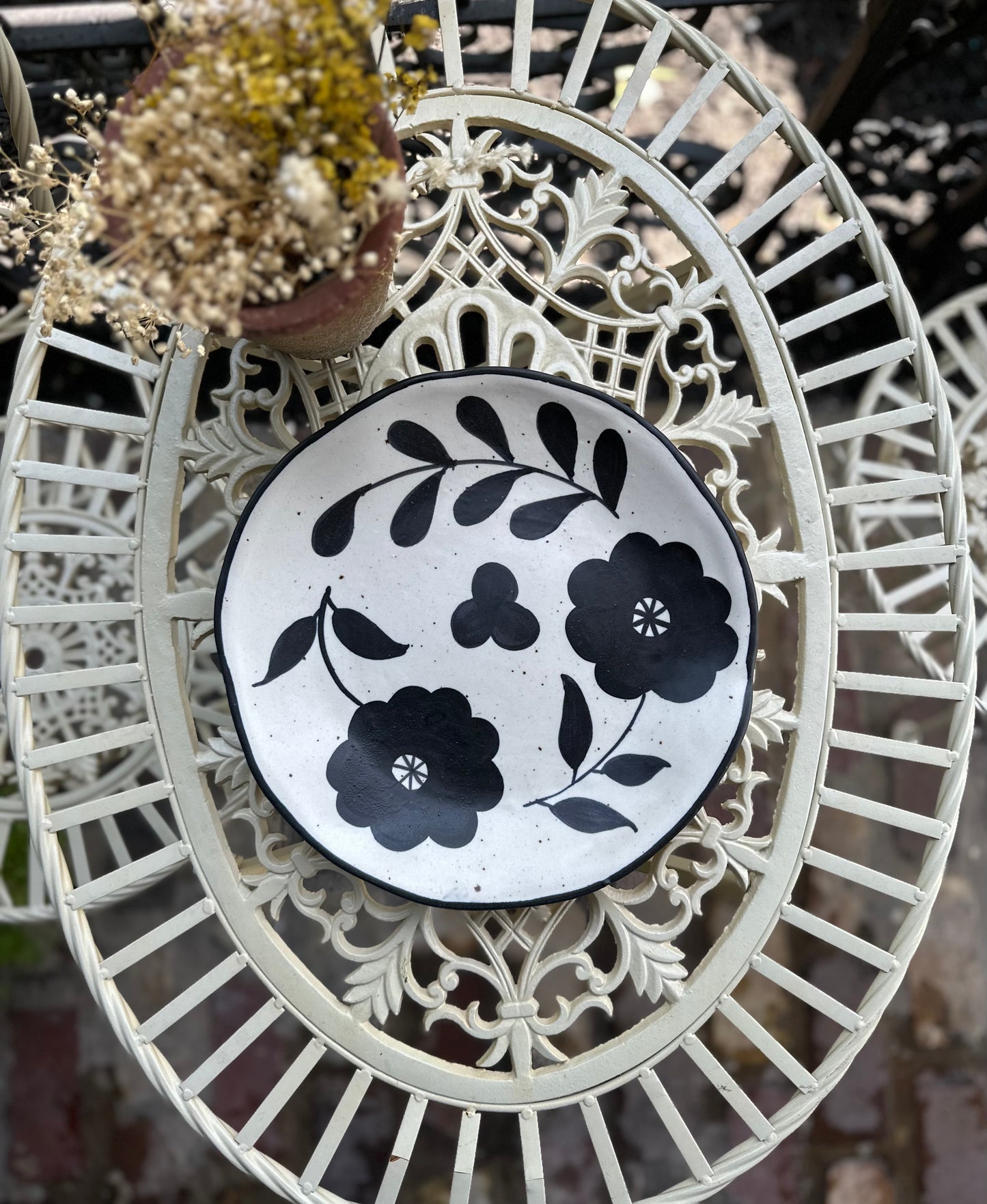 Hand-Painted Matte Black & Cream Colored Stoneware Plate with Floral Design